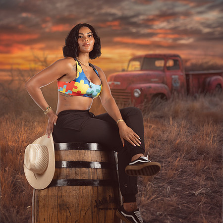 FEMALE ON BARRREL OLD TRUCK