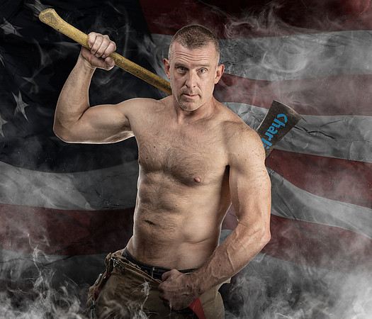 MALE WITH AX IN FRONT OF BURNING BUILDING